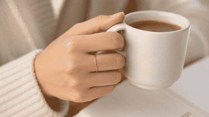 wearing a 14k gold ring for everyday use — durable and practical for daily wear