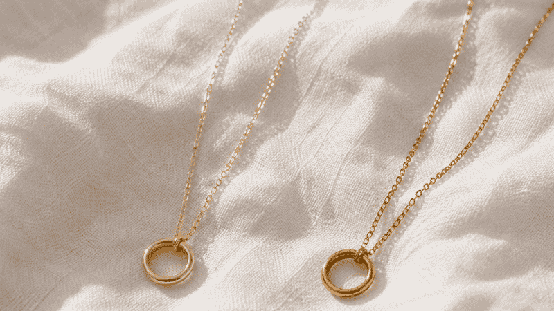 14k vs 18k gold jewelry — two necklaces showing the color difference side by side