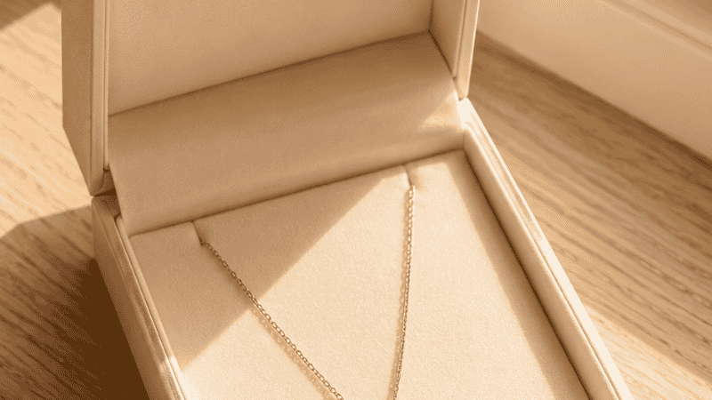 18k gold necklace in a gift box — a meaningful jewelry gift for her