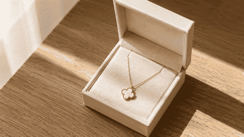 Van Cleef necklace dupe as a gift — four-leaf clover gold pendant in a jewelry gift box