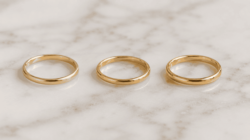 gold plated vs gold vermeil vs solid gold rings comparison — three rings showing different gold tones side by side