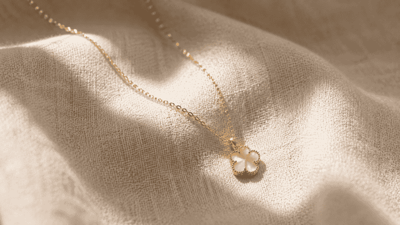 what is gold vermeil — delicate gold vermeil necklace with rich warm gold tone on cream linen
