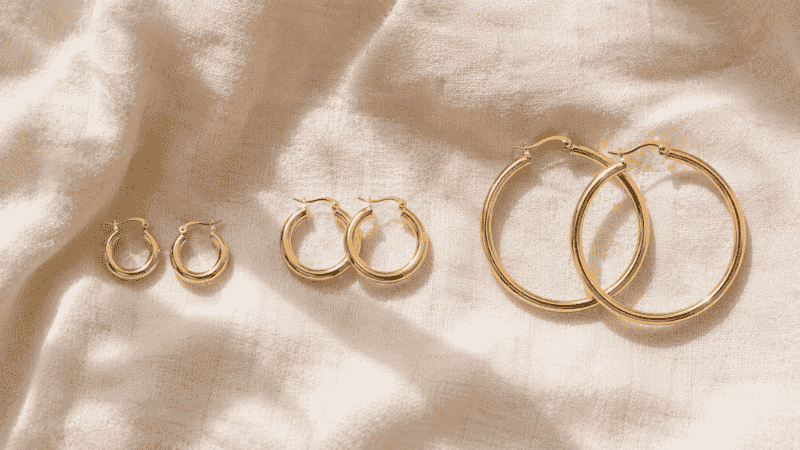 hoop earrings size comparison — three gold hoop pairs at 12mm 20mm and 35mm showing small medium and large diameter difference