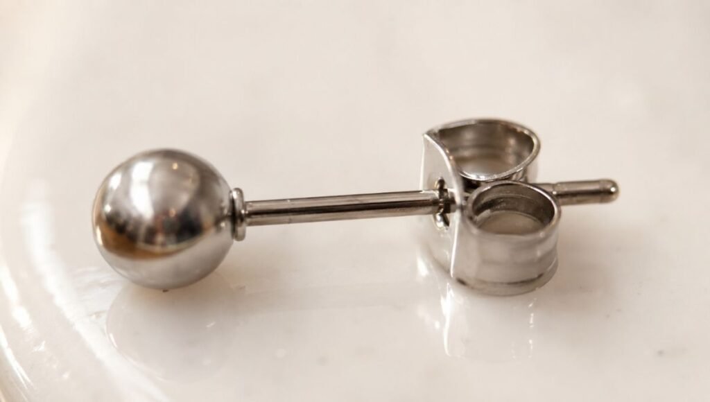 earring post and backing close-up — showing the metal post that contacts ear piercing as most important part for sensitive ears